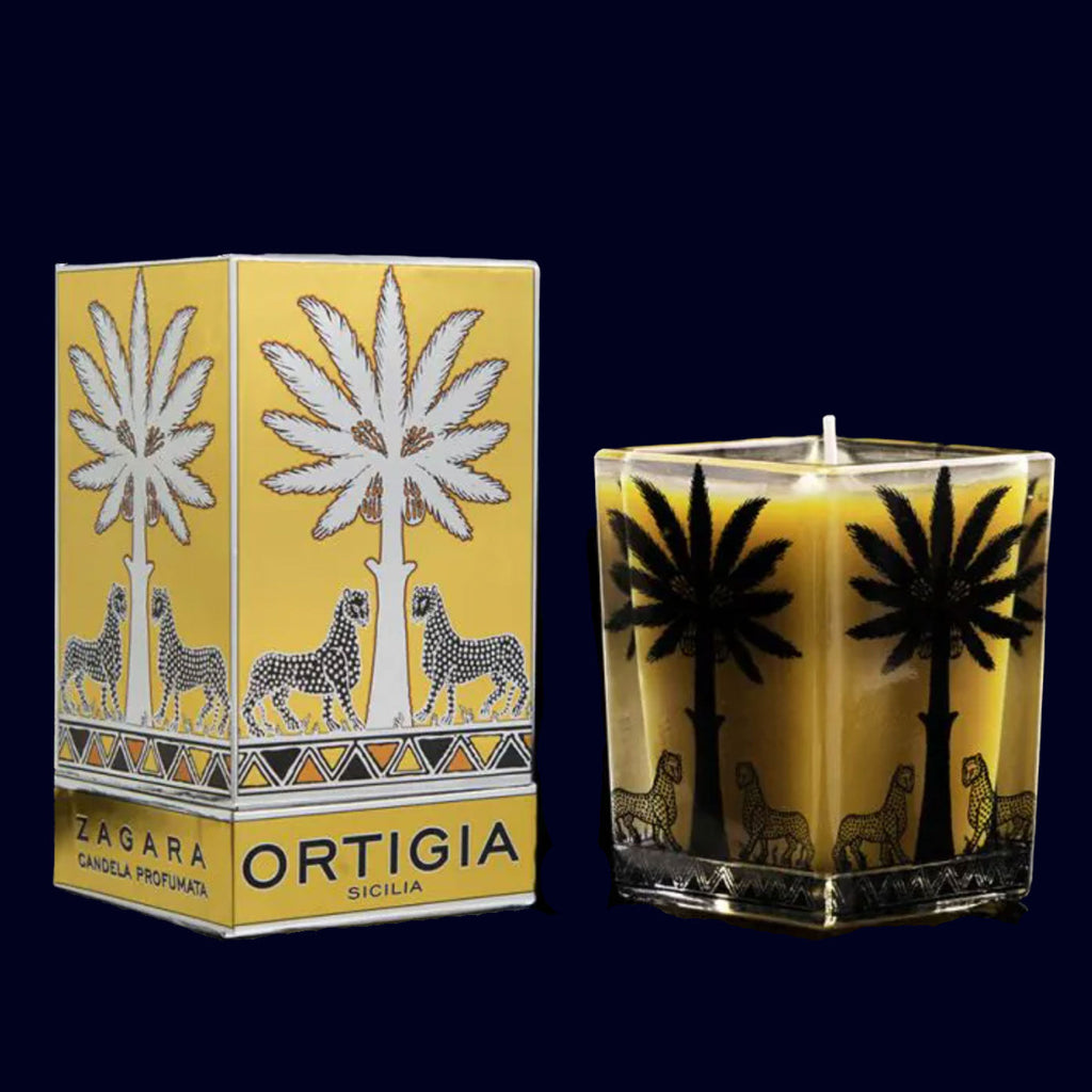 ortigia orange blossom candle in a glass jar with palm tree