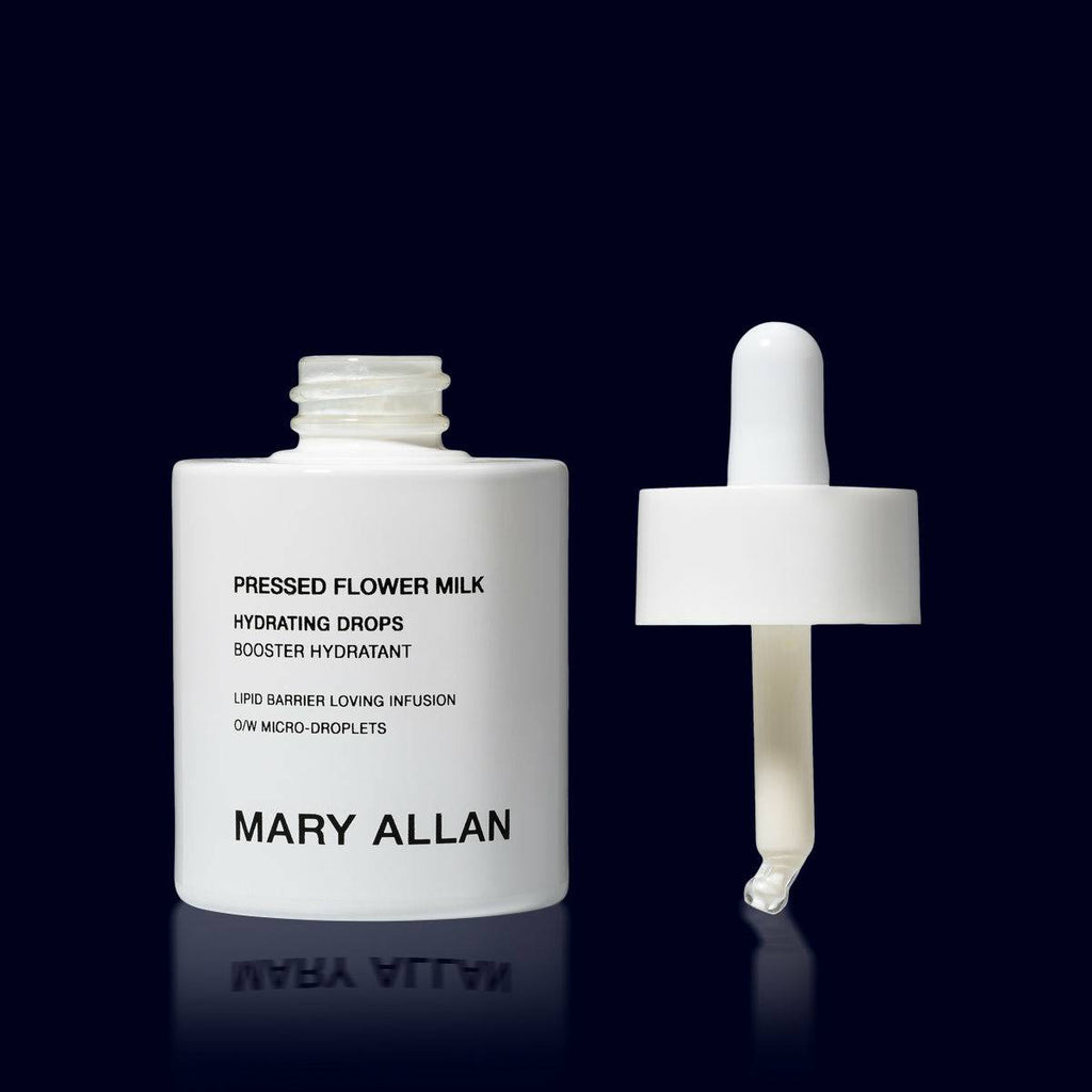 mary allan pressed flower milk hydrating drops in a white glass bottle open