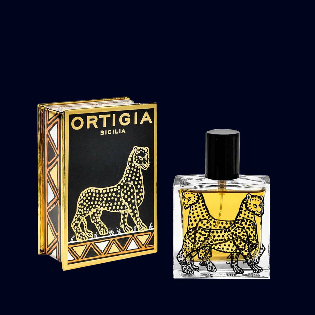 ortigia eau de parfum ambra nera spray. black, gold and silver box with a leopard. square glass bottles printed with black leopard with black lid.