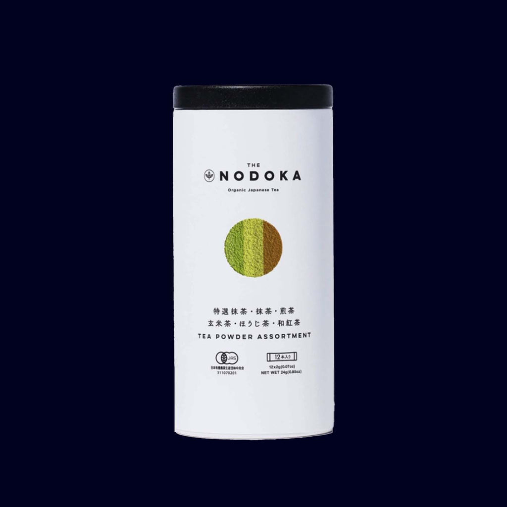 Nodoka organic tea powder assortment canister on a dark background