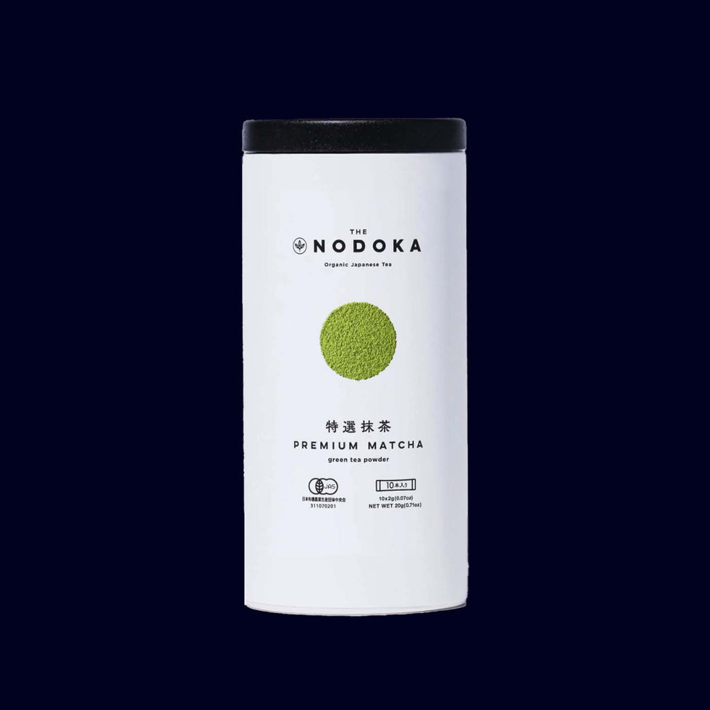 Nodoka organic premium matcha green tea powder canister on a black background