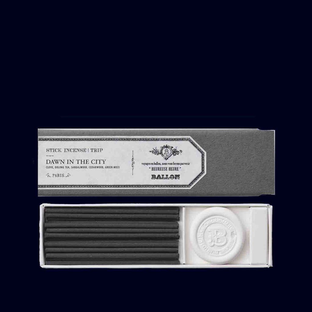 Incense sticks packaging with a label on a black background
