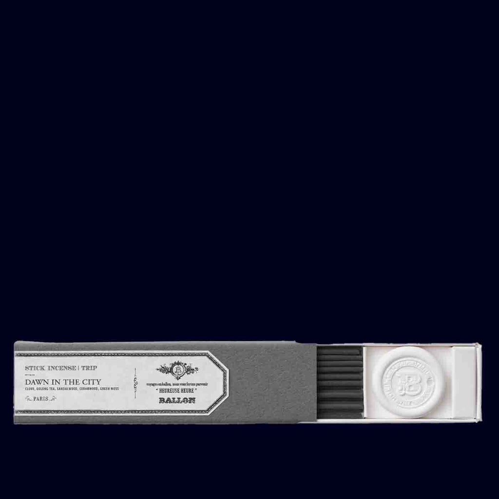 Incense stick packaging with label on a black background