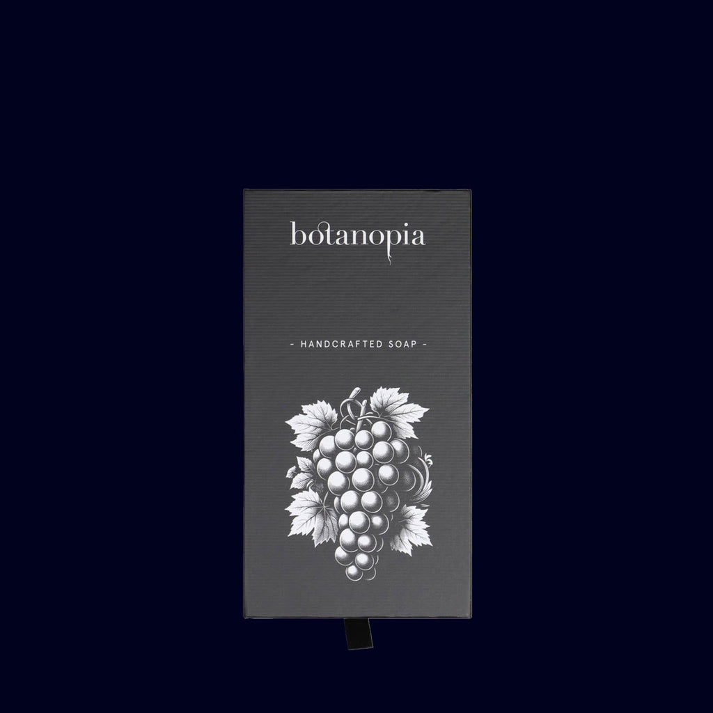 (botanopia) handcrafted soap packaging with grape illustration on a black background