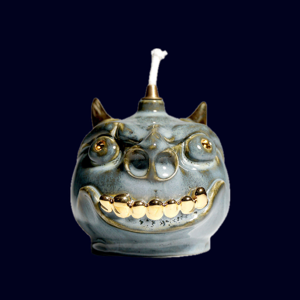 dogabi oil lamp ceramic monster gold teeth