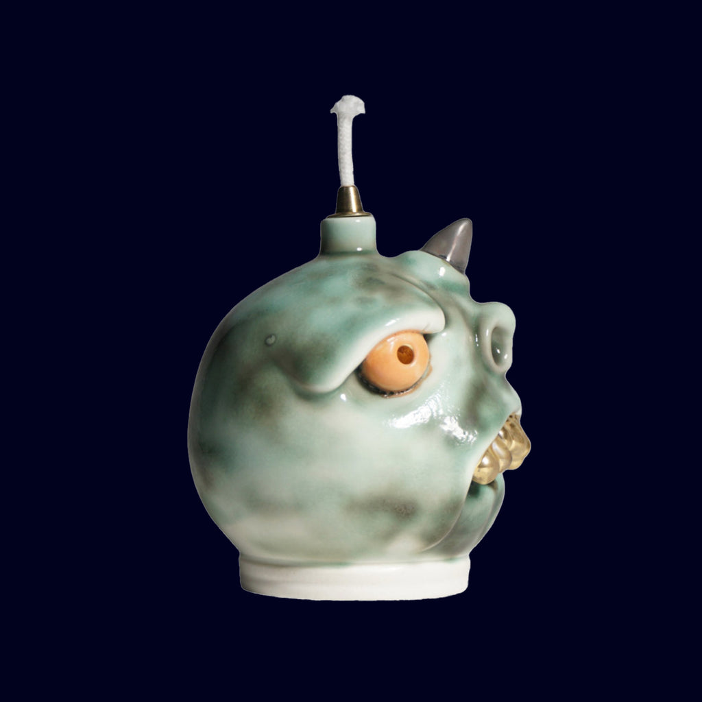 ceramic dogabi oil lamp with gold teeth