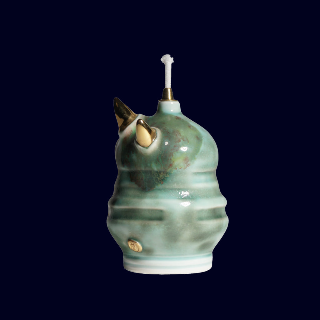 dogabi ceramic oil lamp monster with gold teeth