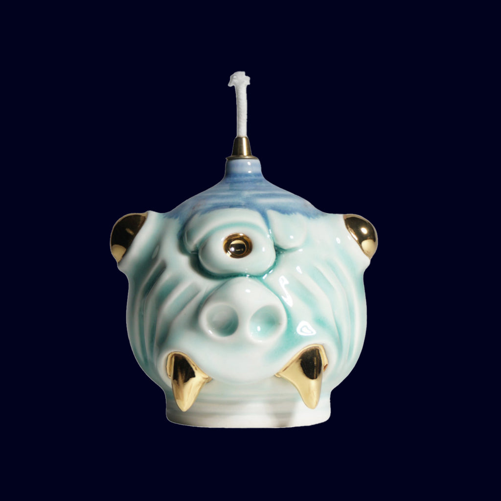 dogabi ceramic oil lamp monster with gold teeth