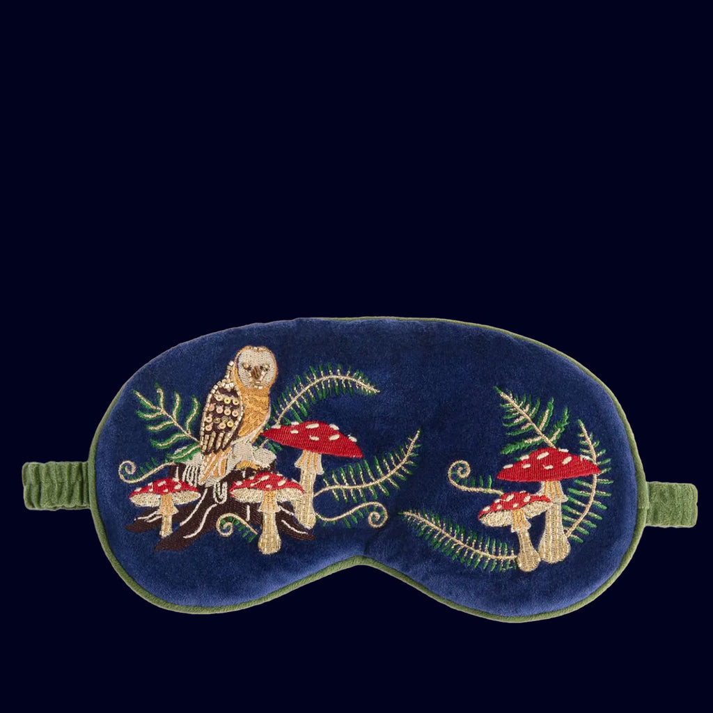 Embroidered eye mask with owl and mushrooms design on a dark blue background