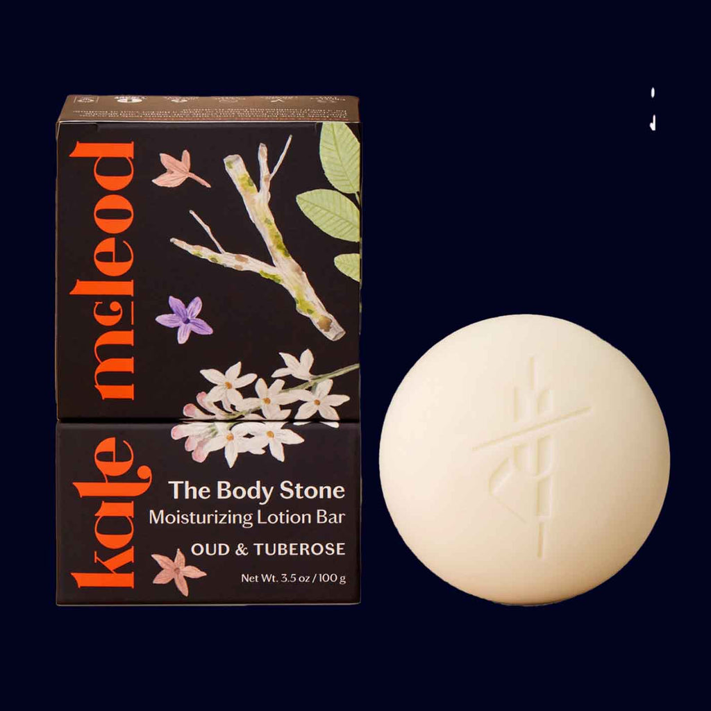 Kate McLeod body stone and packaging on a dark background