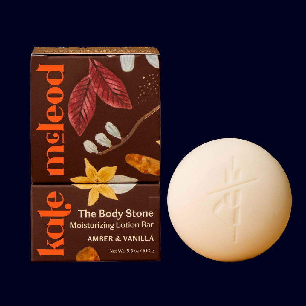 Kale Meleod lotion bar with packaging on a dark background