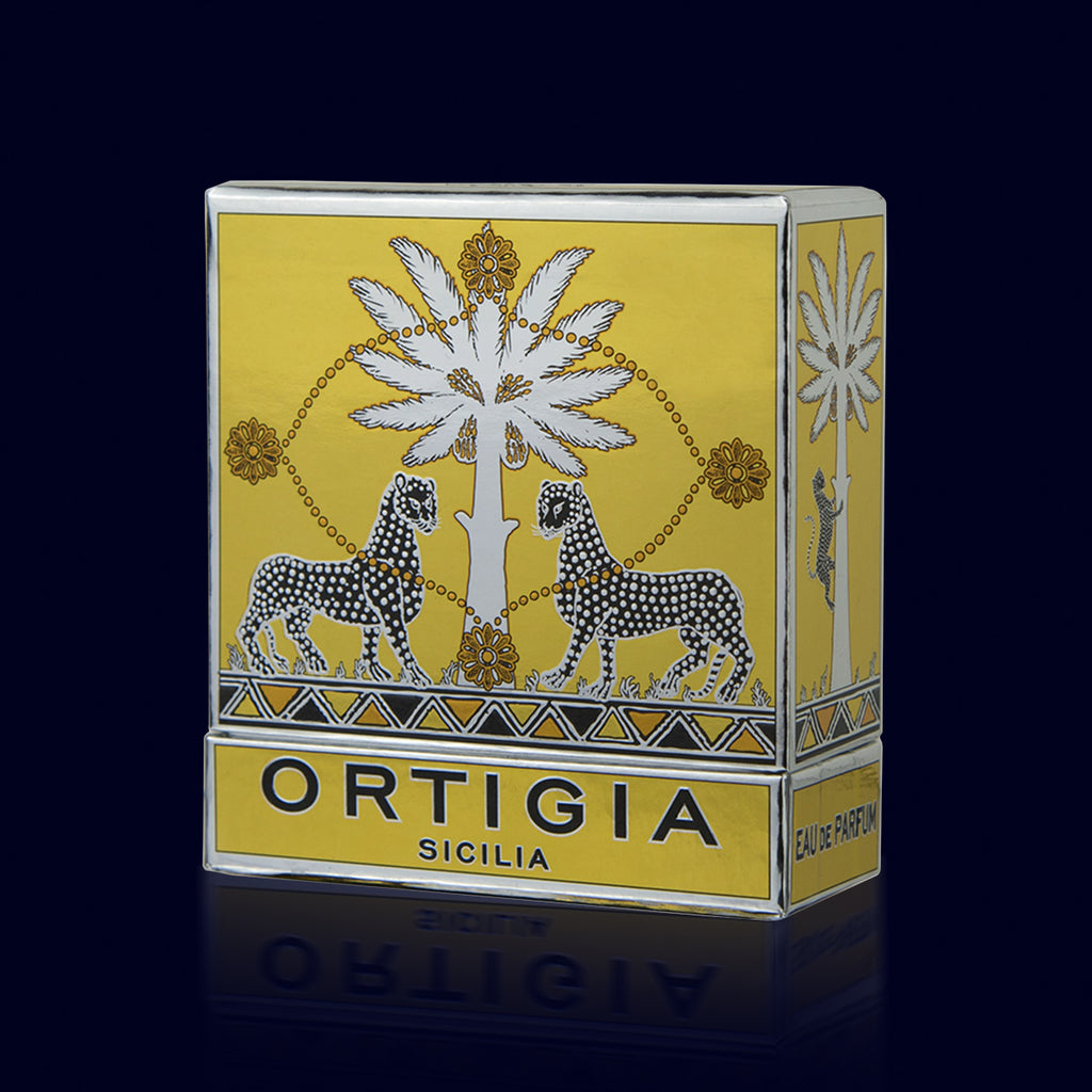 ortigia spray perfume in a glass bottle printed with black leopards and its gold and silver box. zagara-orange blossom box