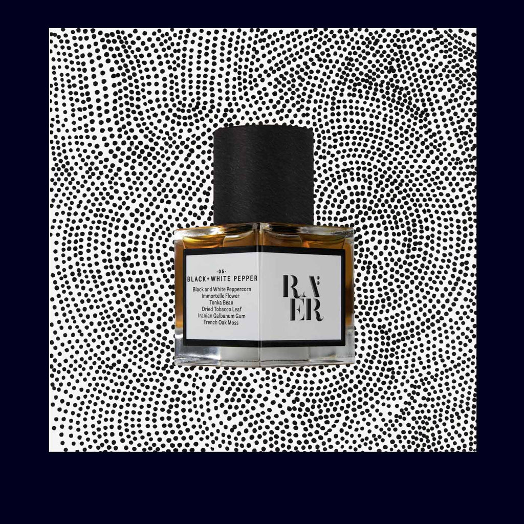 bottle of raer perfume black and white pepper
