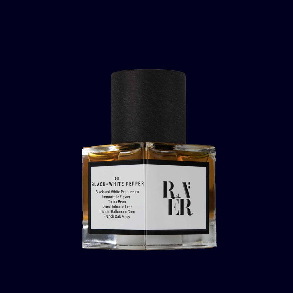 bottle of raer perfume black and white pepper