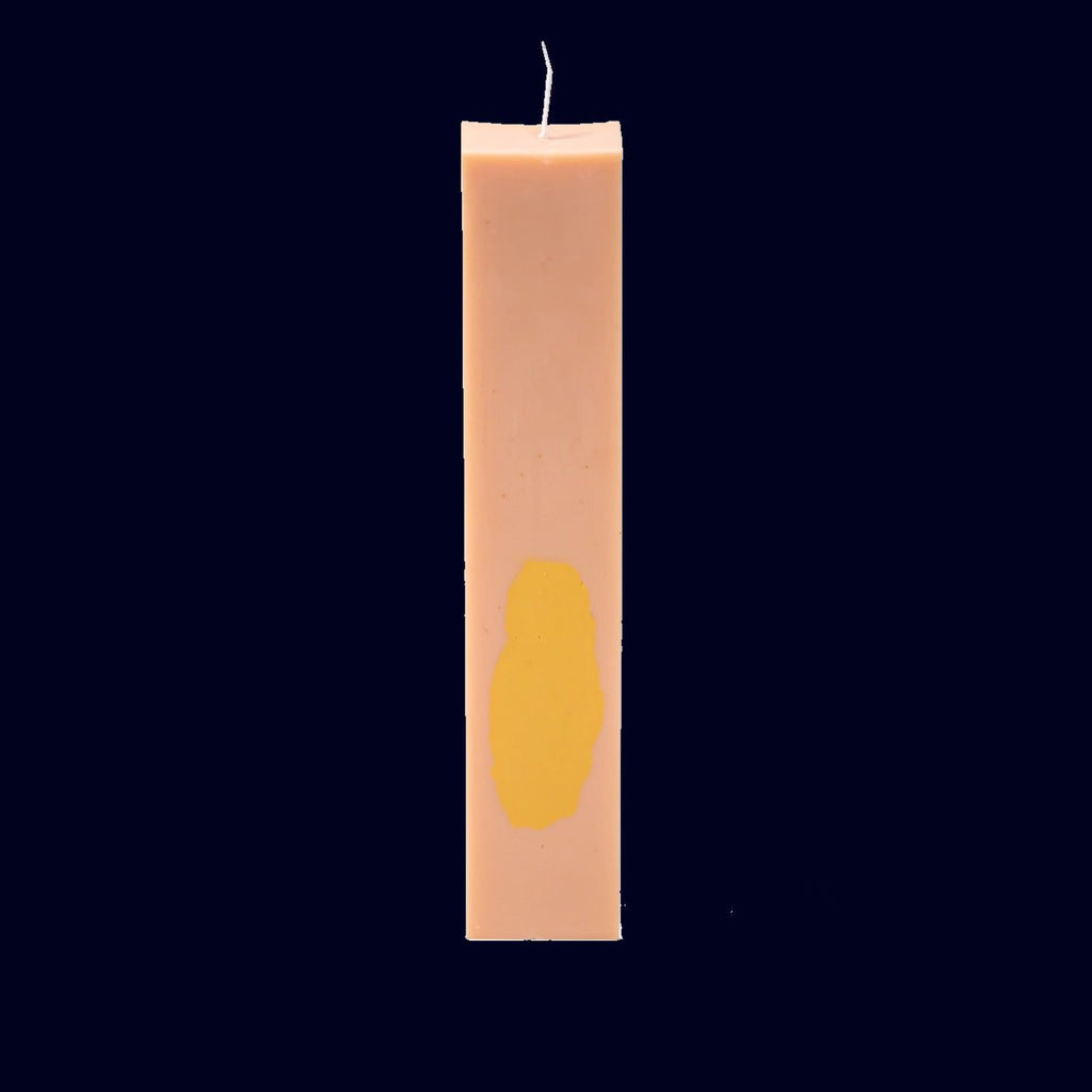 Pink and yellow pillar candle