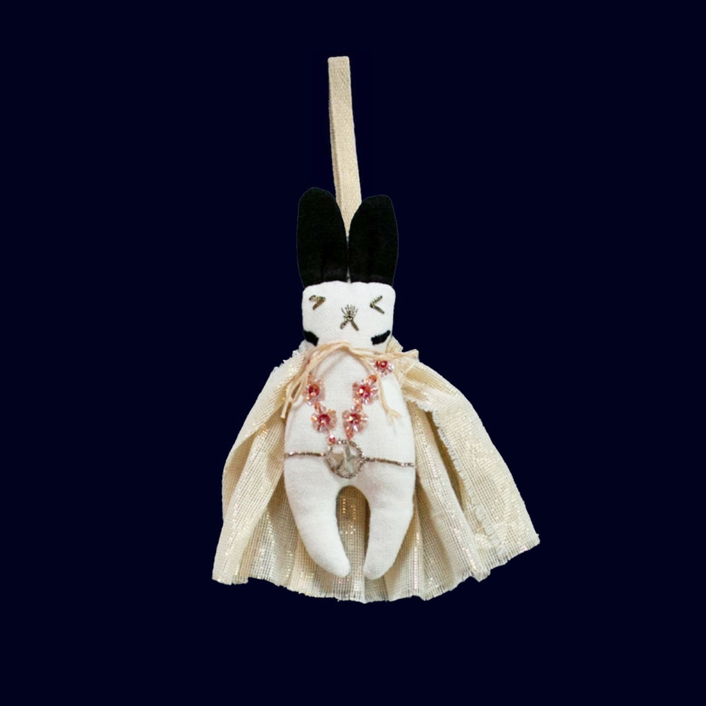 Decorative ORNAMENT figure with a dress on a dark background