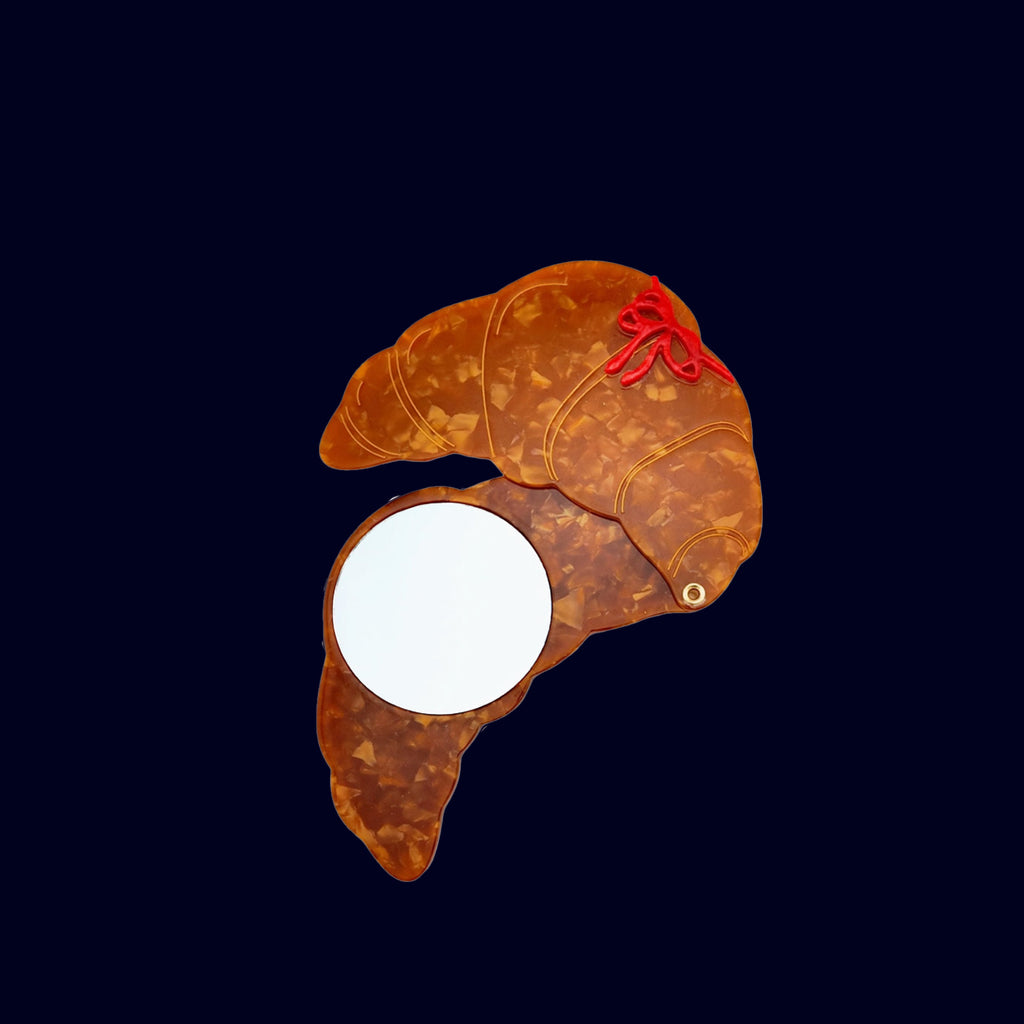 compact mirror croissant shape