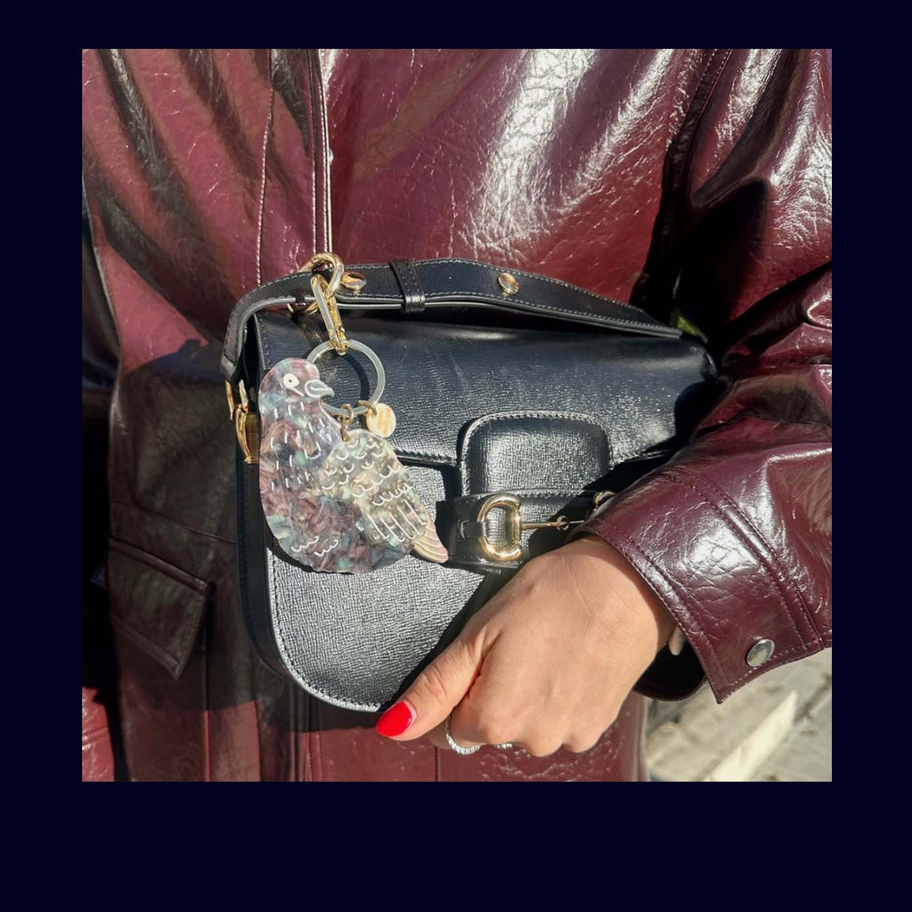 bag charm shape as a pigeon on a bag