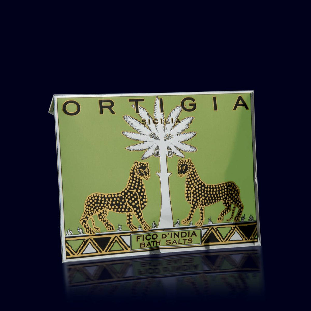 ortigia fico d'india bath salts in a green and silver envelope. leoaprd and palm trees