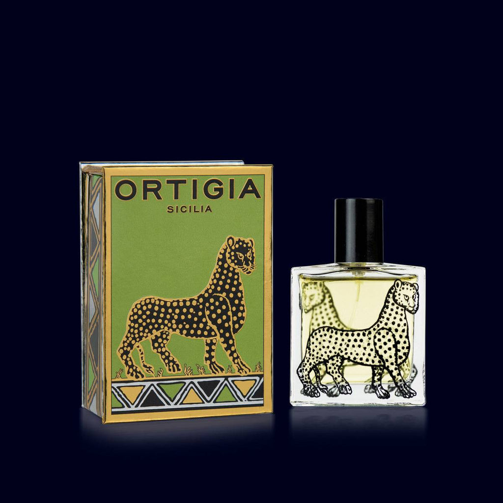 ortigia signature scent in a glass bottle printed with black leopard and its green, gold and black luxurious box. fico d'india