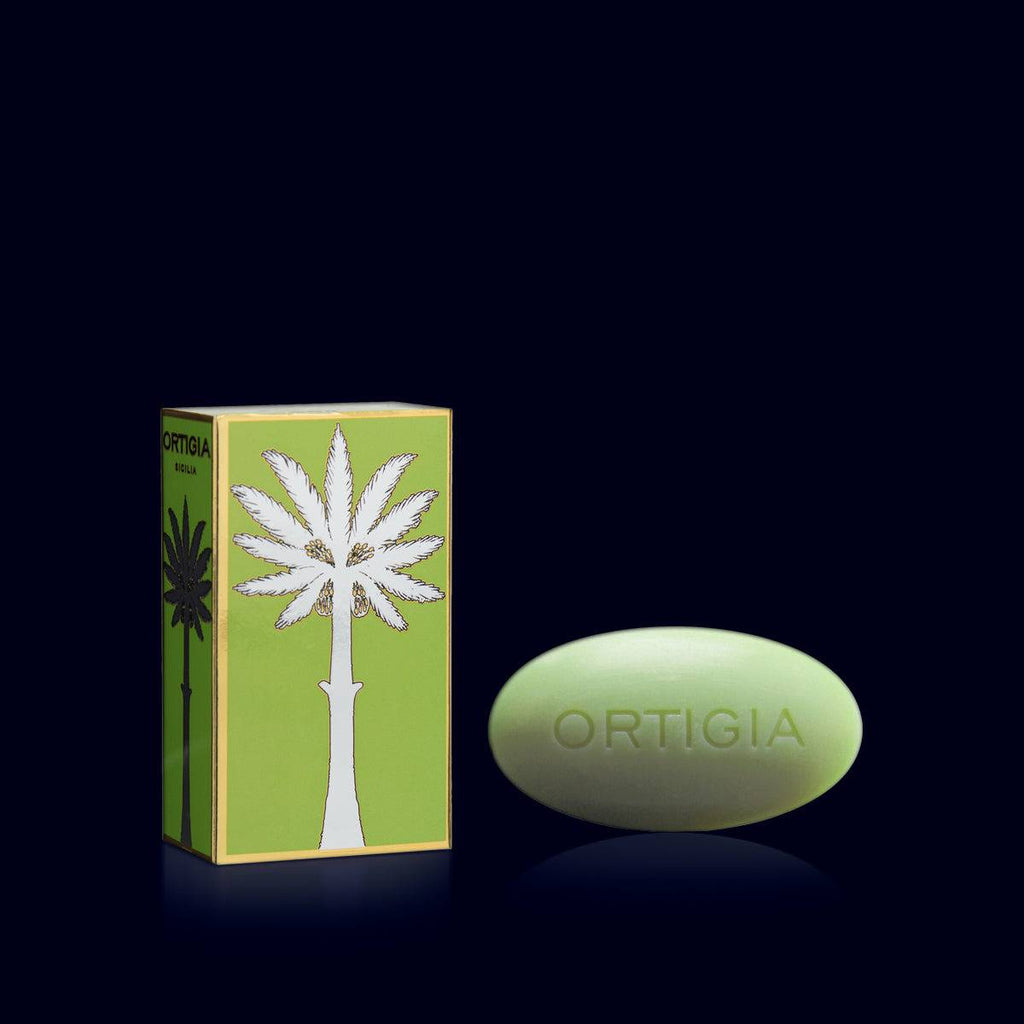 ortigia oval soap pale green next to its metallic greean and silver gift box. fig- fico d'india