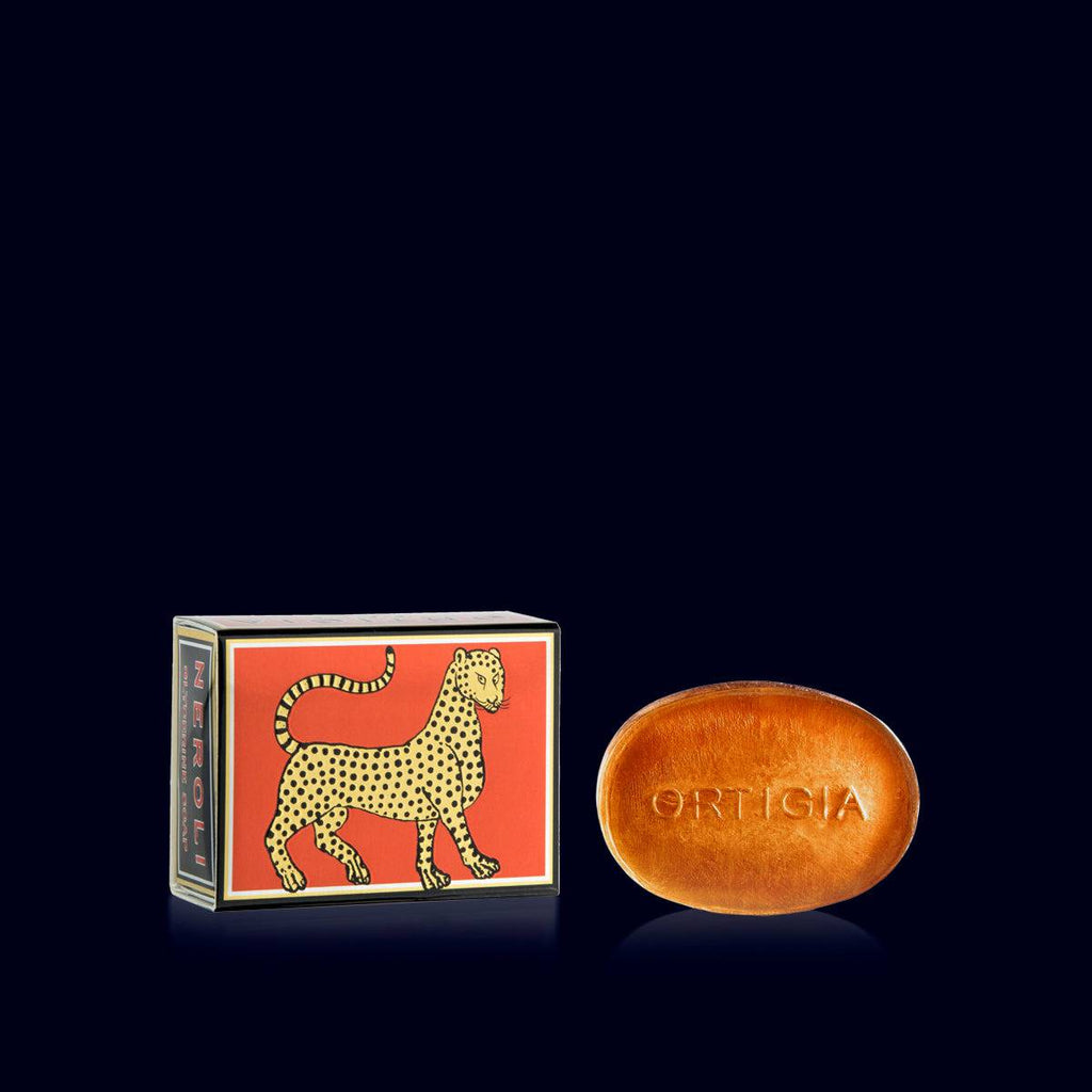 ortigia glycerin soap, orange, and its metallic orange and gold gift box ornated with a leopard-oneroli- sicily