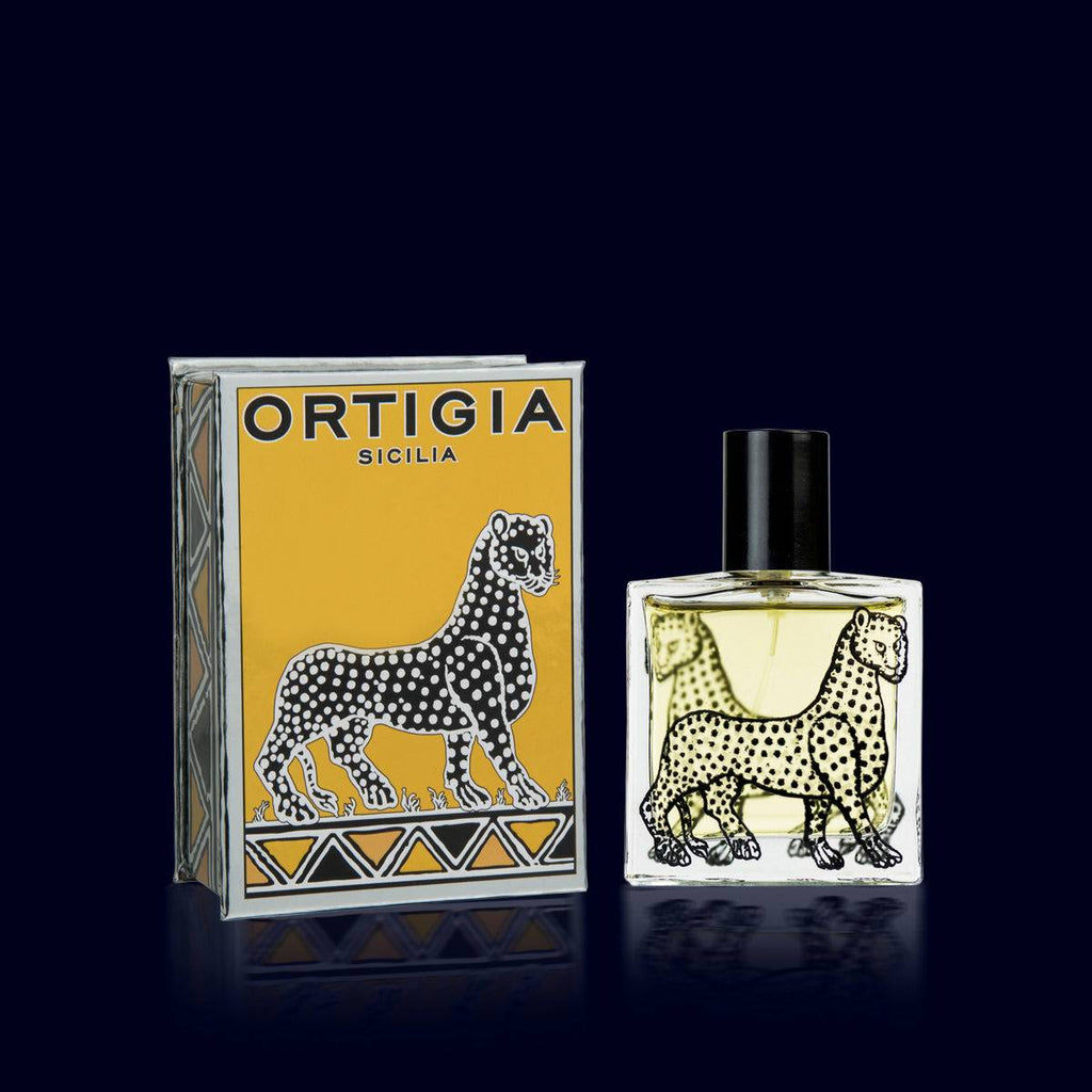 ortigia spray perfume in a glass bottle printed with black leopards and its gold and silver box. zagara-orange blossom