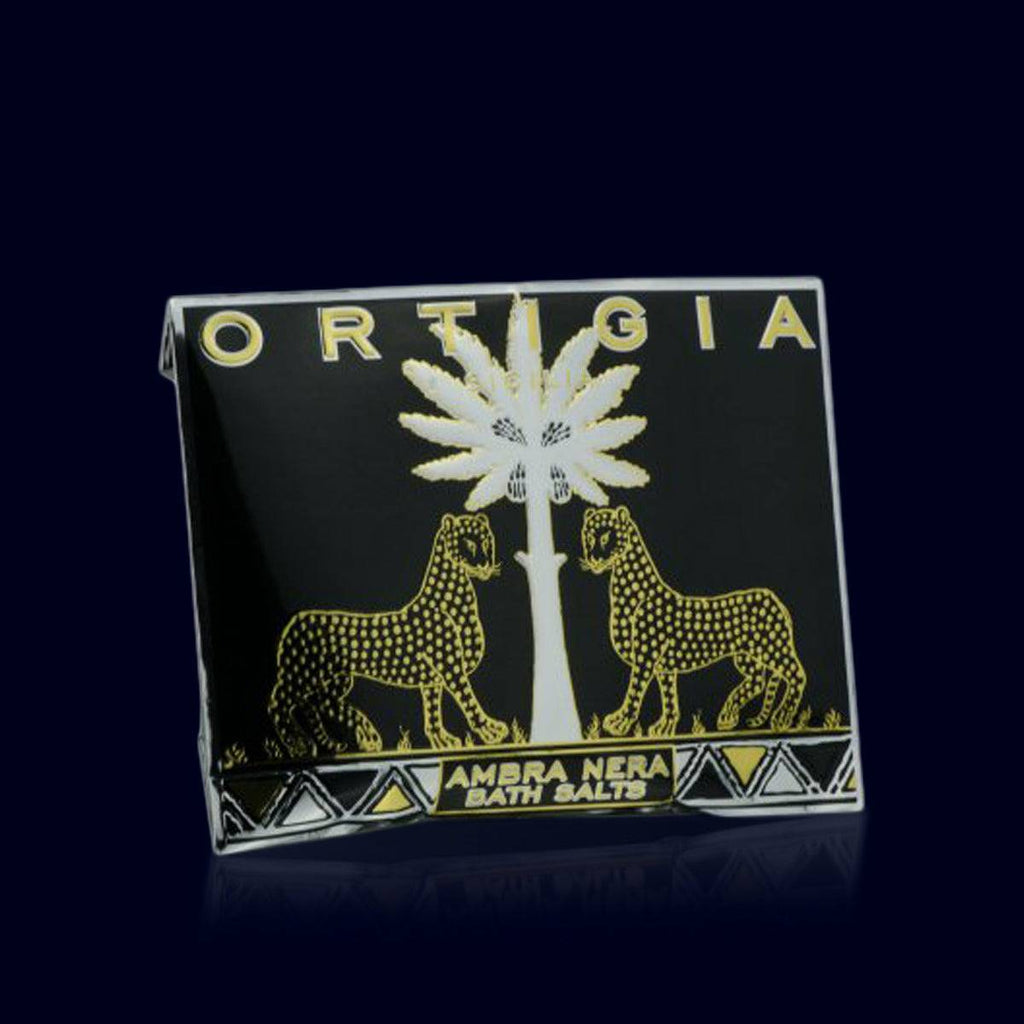 ortigia amber bath salts in an black, gold and silver envelope. leopard and palm trees