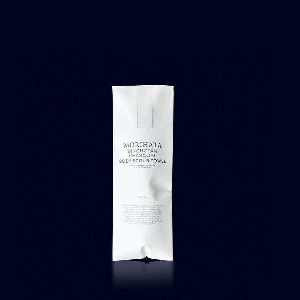 Paper packaging of body scrub towel infused with charcoal to exfoliate the skin from Morihata. Made in Japan