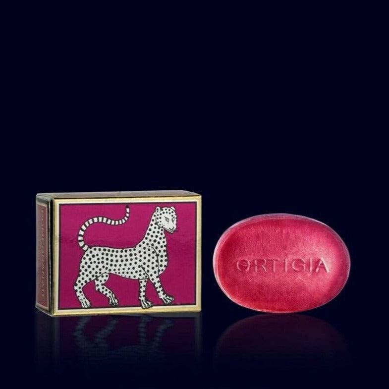ortigia glycerin soap, red, and its metallic red and gold gift box ornated with a leopard-pomeganate- sicily