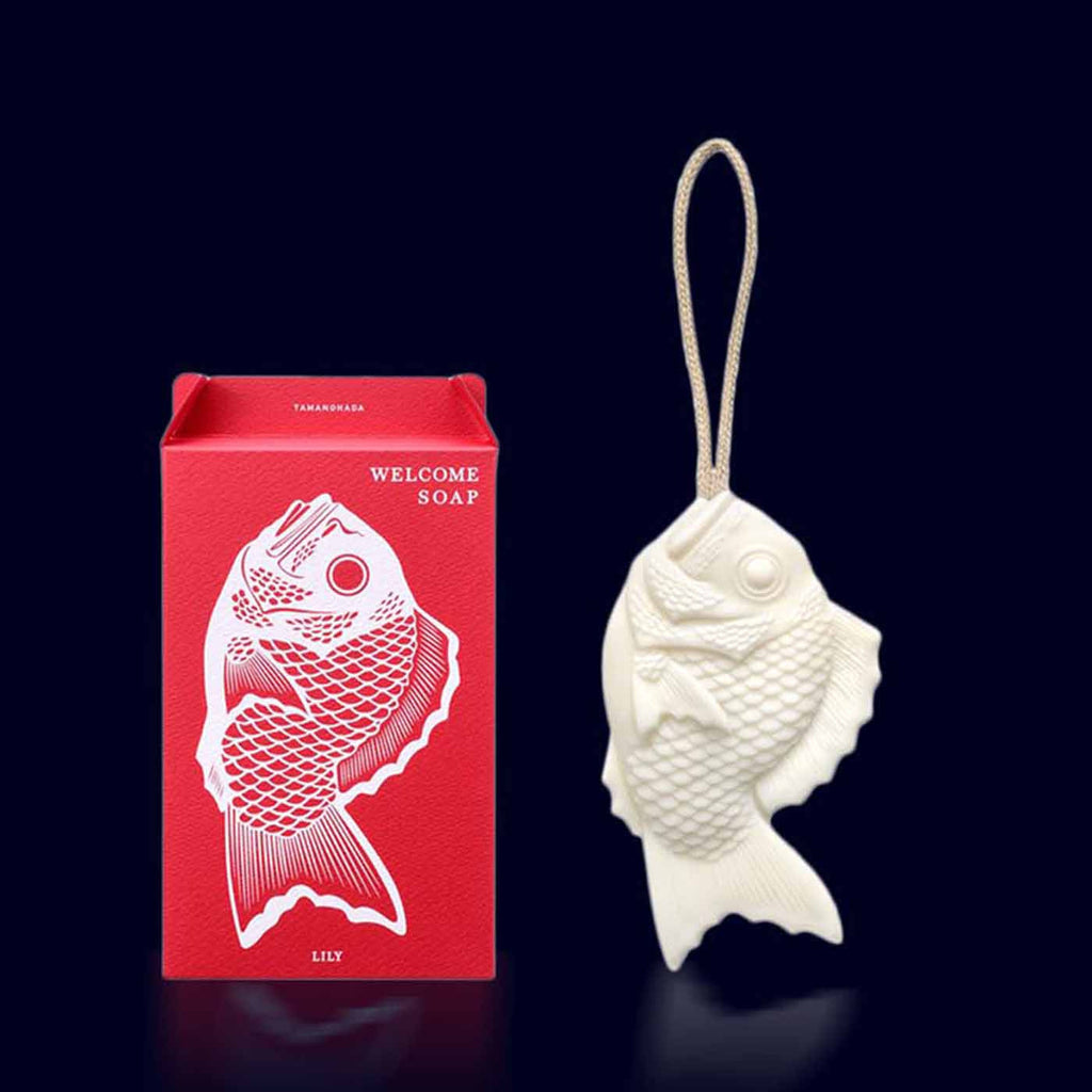 welcome soap- japanese white soap on a rope shaped as a fish in its pale red box. lily of the valley-tamanohada